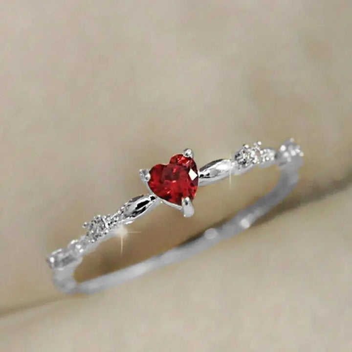 Gold ring with a heart-shaped ruby