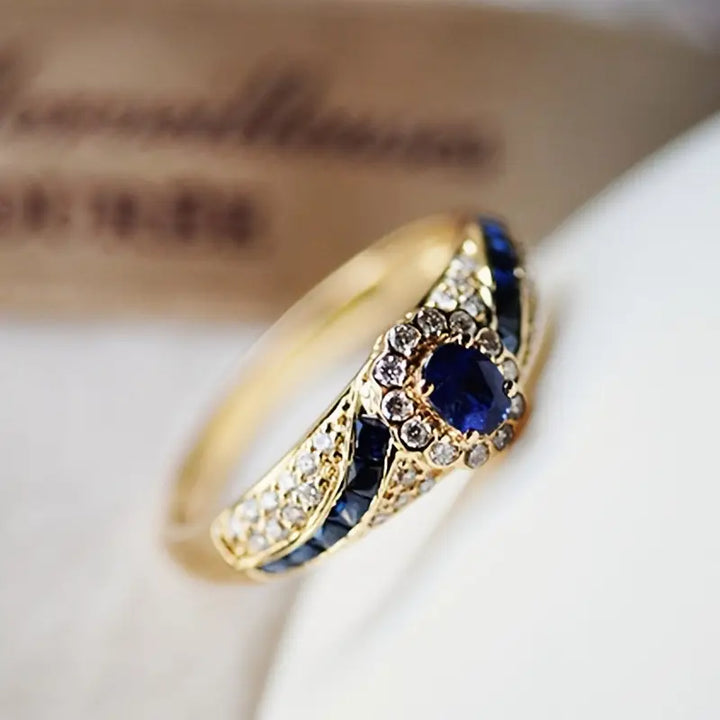 Gold wedding band with sapphire