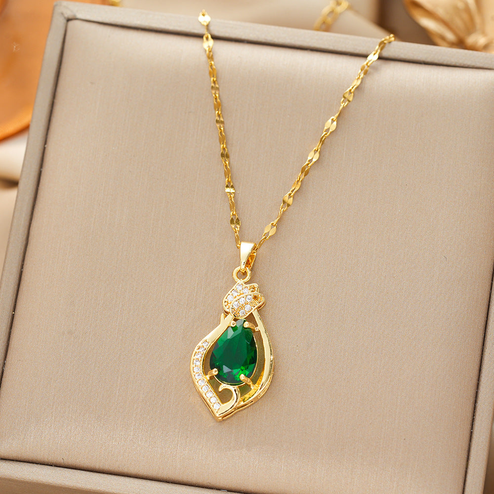 Necklace with a gold teardrop-shaped emerald pendant
