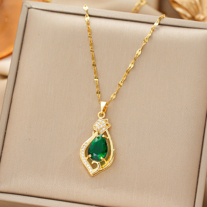 Necklace with a gold teardrop-shaped emerald pendant