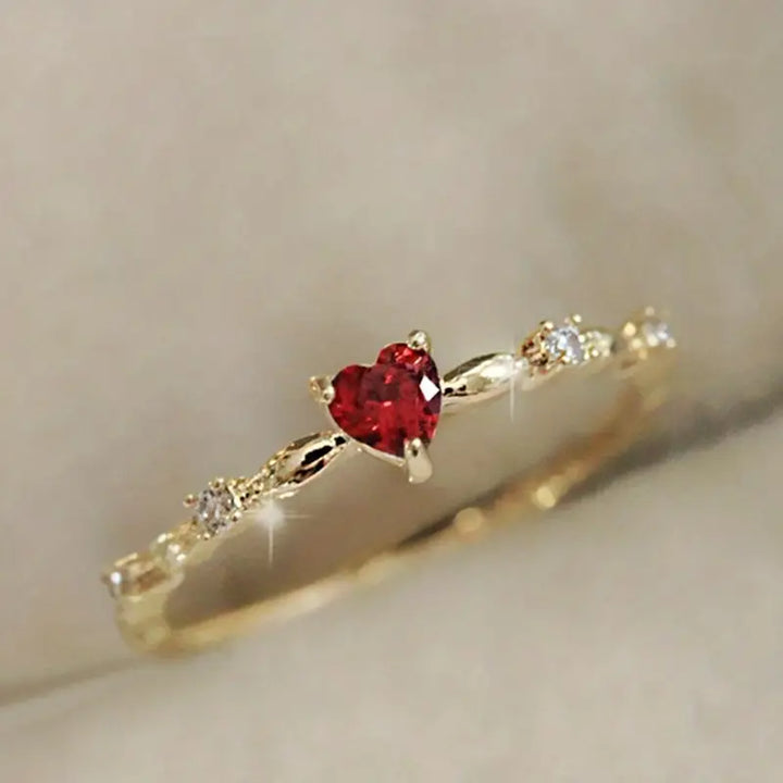 Gold ring with a heart-shaped ruby