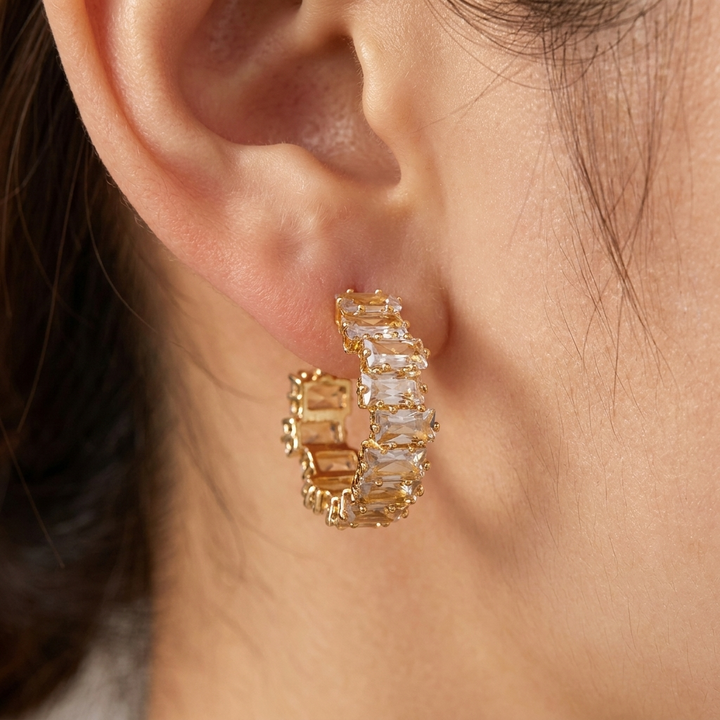 Elegant gold earrings with sparkling zircon