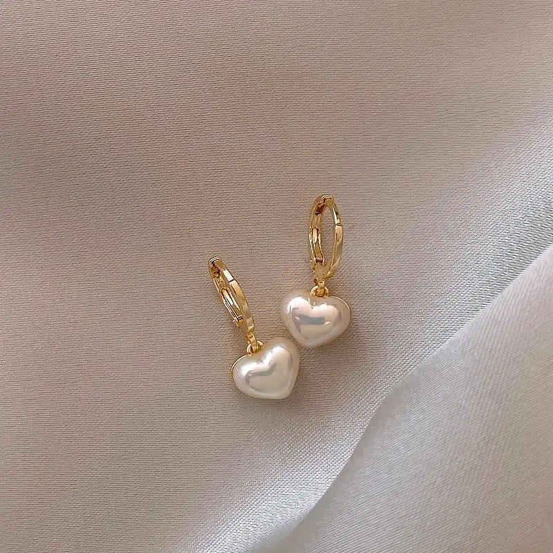 Gold drop earrings with heart and pearl